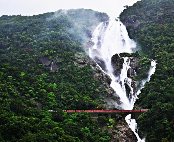 Majestic view of Dudhsagar Falls cascading down the rocky terrain in Goa, India.